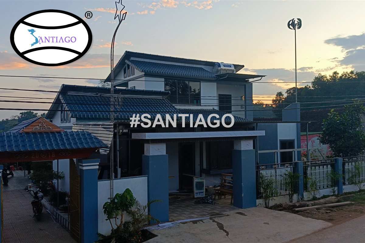 Nhà hai tầng mái dốc lợp tôn nhựa giả ngói xanh tại Nghệ An